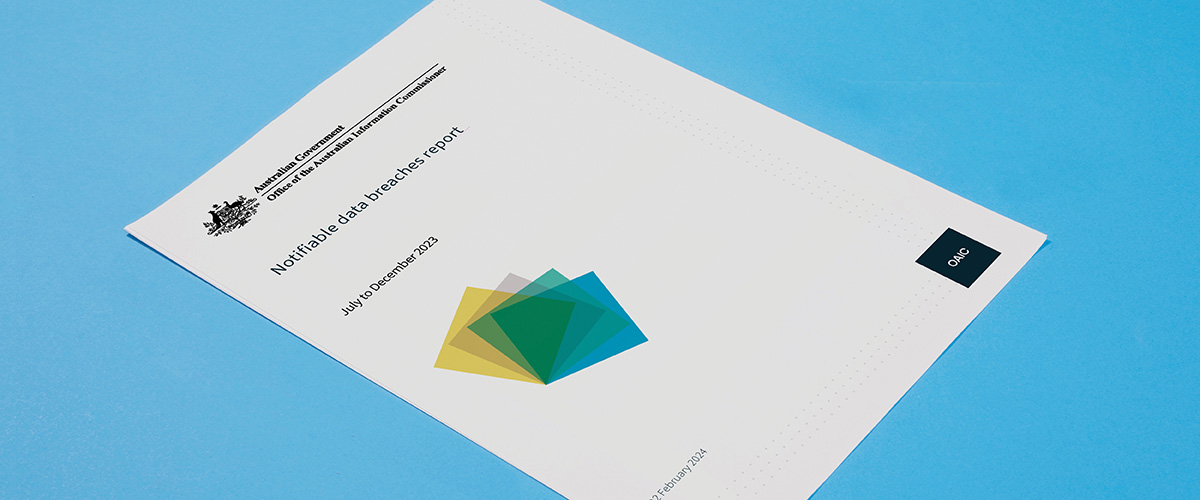 Notifiable Data Breaches report page on blue background