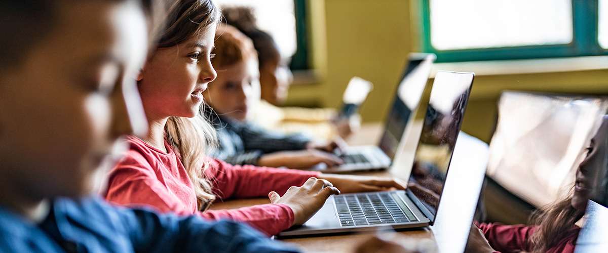 Photograph of young people using computers